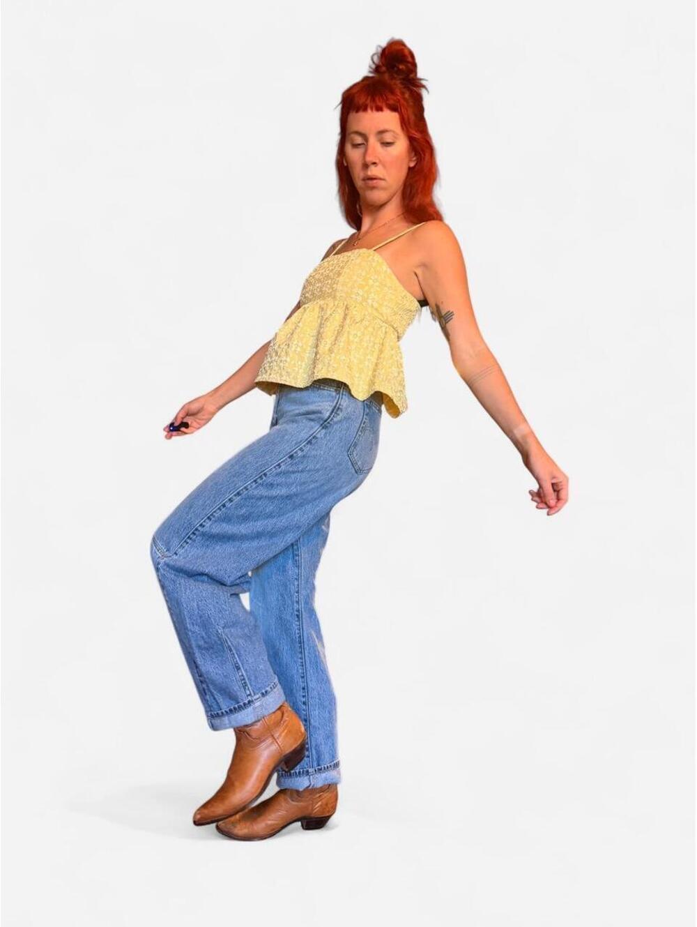 Butter yellow babydoll top with adjustable straps and ruffle hem. Size: XS